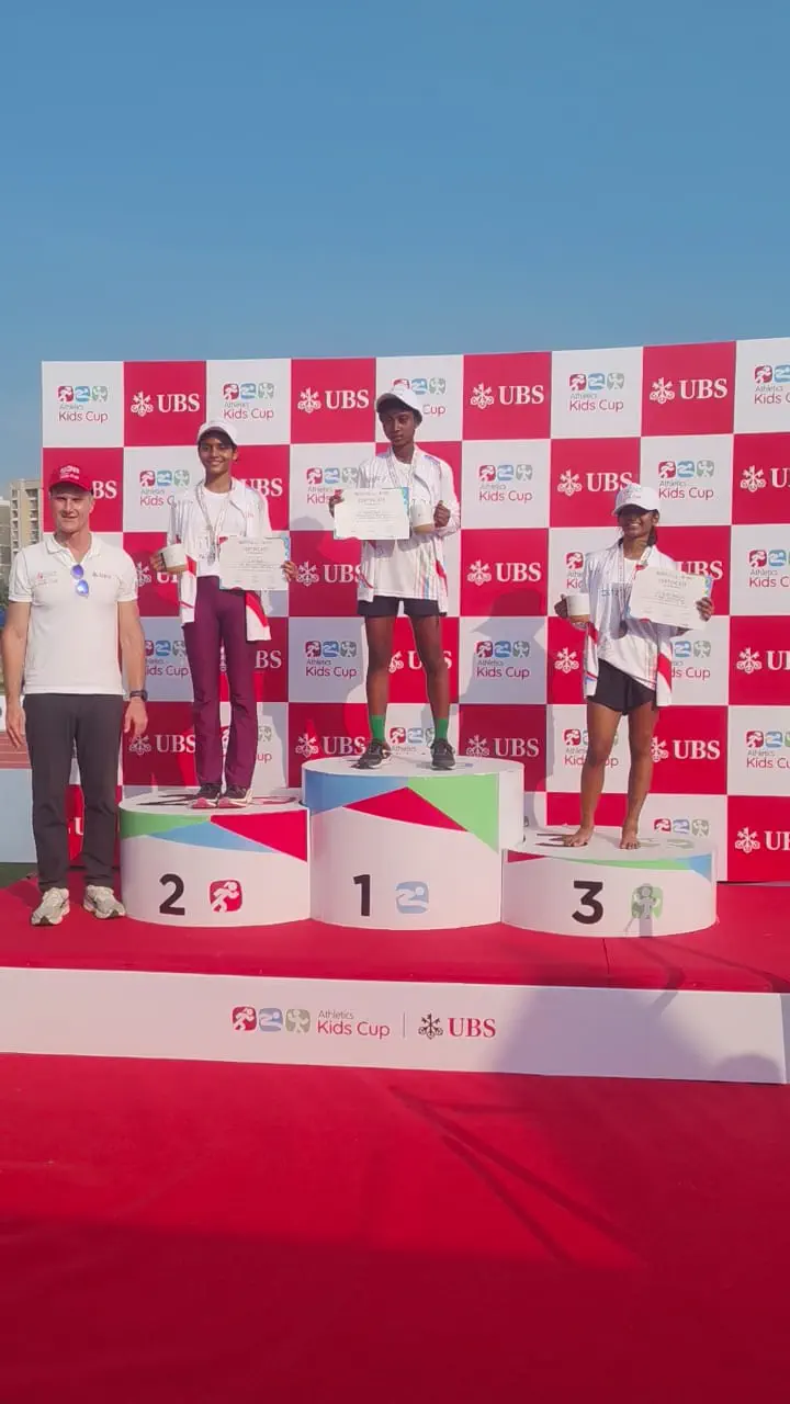 Podium finishers with certificates at UBS Kids Cup ceremony