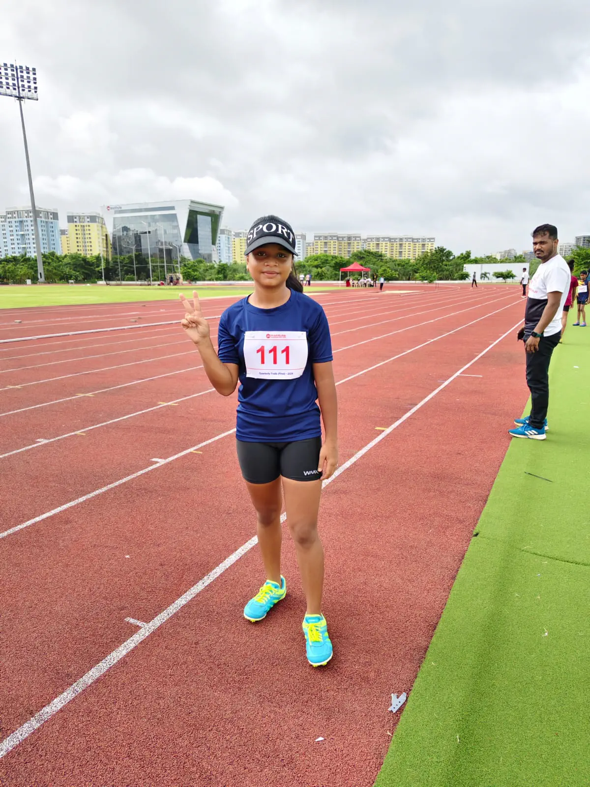 Risers athlete preparing for start on red track